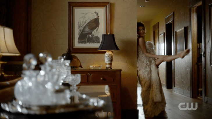 Cristal wrapped in a rug, sticking out her leg