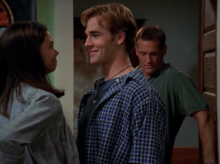 Joey and Dawson give each other rueful smiles as Mitch stands in the doorway of Dawson's room.