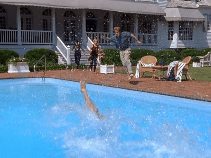 Kids (Dawson, Joey, Jen, Andie) running towards a pool, with Dawson in mid-air and someone else's leg sticking out.