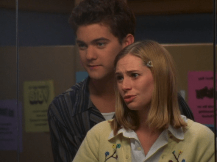 Pacey hugs Andie while they both look in the mirror. Andie's eyemakeup is smeared.