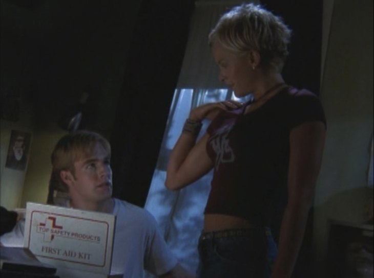 Eve stands in Dawson's bedroom (right), while Dawson sits down (left) with a First Aid kit.