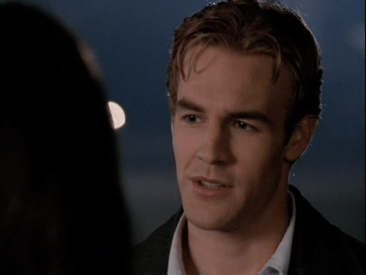 Exterior, nighttime. Closeup of Dawson with wet-looking hair.