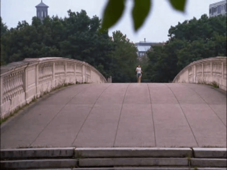 Shot of a bridge with Joey running alone down the middle of it.