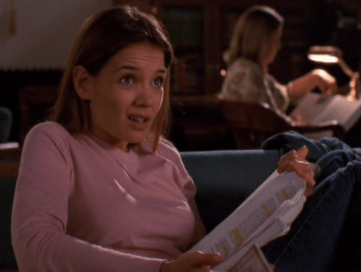 Shot of Joey making a "duh" face while holding a printout full of highlighting.