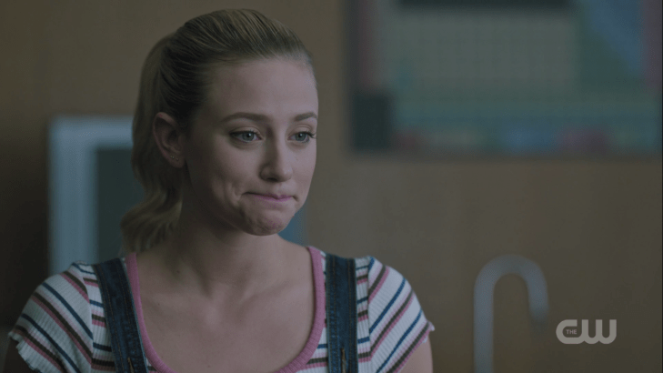 Betty presses her lips together, clearly trying not to smile.