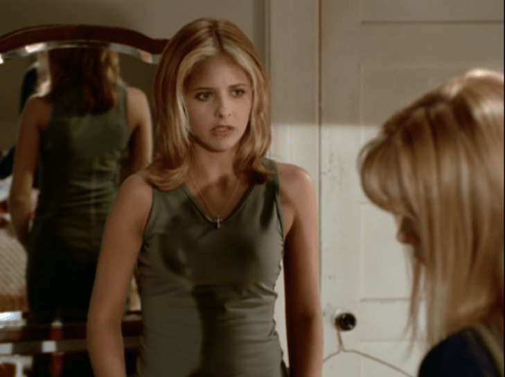 Buffy has reddish hair with blond highlights just at the front, cut in flippy shoulder-length layers.