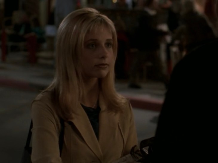 Buffy has new bangs that are about an inch above her eyebrows.