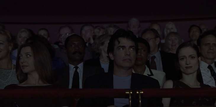 Image description: Jonathan and Kathleen in the audience, making annoyed faces