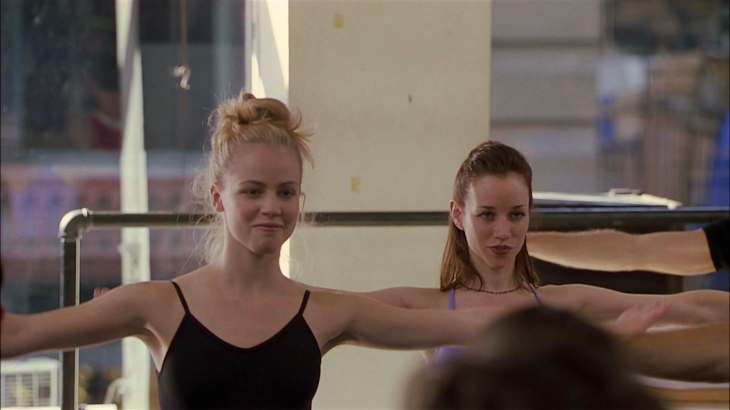 Image description: Jody in a leotard, making a very turned-on face.