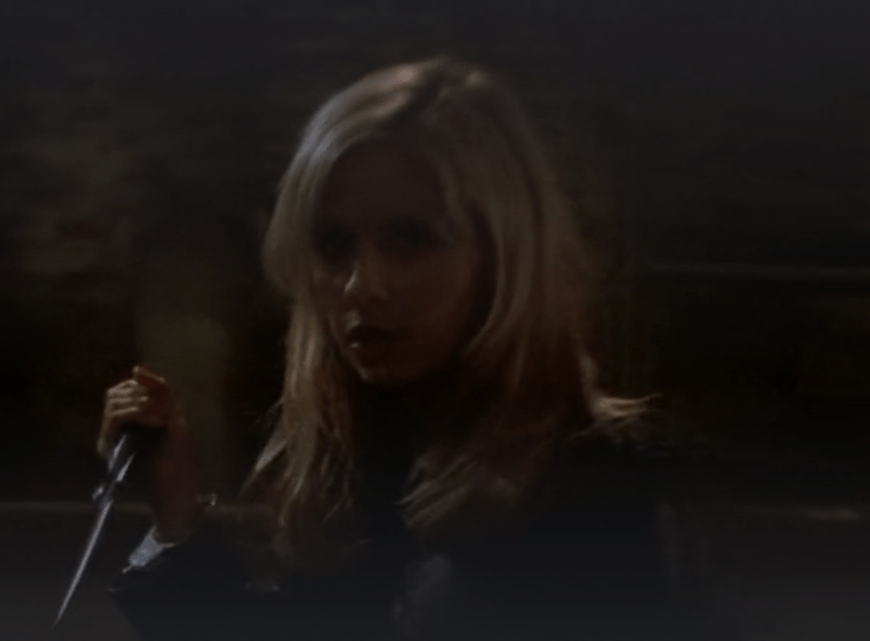 Buffy holds a big knife at the ready.